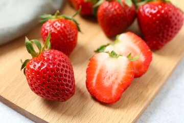 Delicious fresh red strawberries on a wooden background
