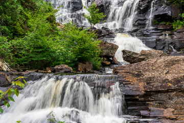 rocky waterfall, rushing streams of water
