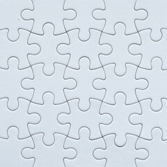 Close-up white jigsaw puzzle background surface with copy space