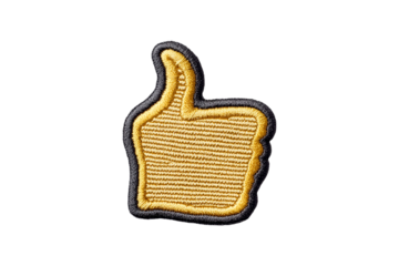 Gold embroidered thumbs up patch on black background