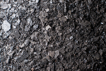 Soot from a chimney, close-up. Cleaning the chimney after the heating season in winter