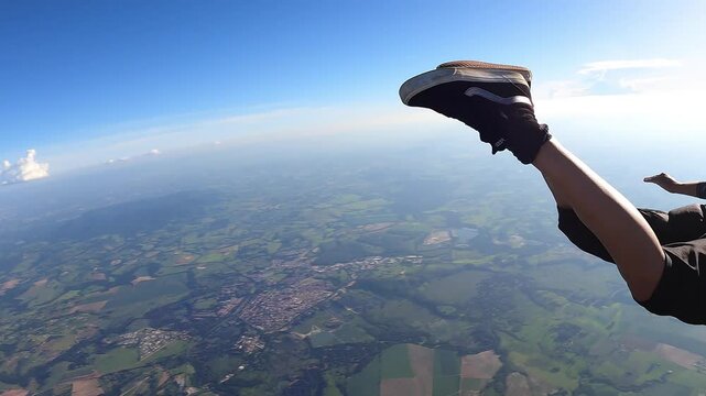 A Brazilian skydiver in free fall, on a summer day. Smiling and confident.