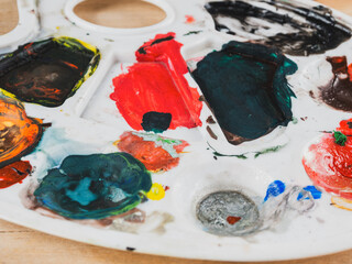 An artist's palette with bright colors, ready to create new masterpieces.