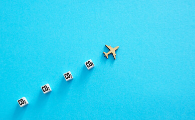 Airplane model and CO2 as a symbol of aviation emissions and environmental impact.