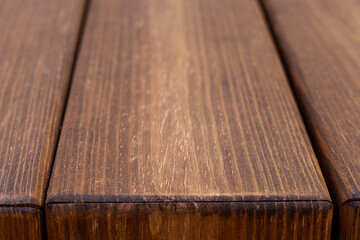 Close-up of wooden boards showcasing natural texture and rich brown tones