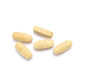 Green pills, medicine isolated on white background, top view