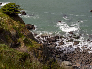 View of rocks in the water from the Batteries to Bluffs Trail in San Francisco, California.