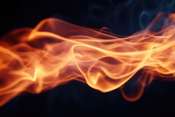 Fototapeta premium Dynamic flames dance against a deep black background, creating a striking contrast that emphasizes their vibrant colors and movement.