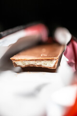 Detail photo of a tasty chocolate bar with white chocolate filling.