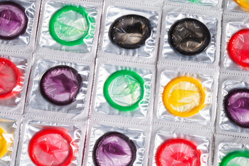 Colorful condoms background.