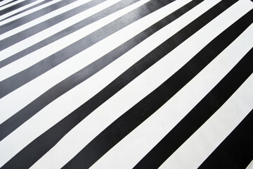 A stark black and white diagonal stripe pattern with perfect alignment and high-contrast optical illusions.