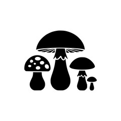 The mushrooms are all black and have a round, bulbous shape. Concept of nature and the beauty of the natural world