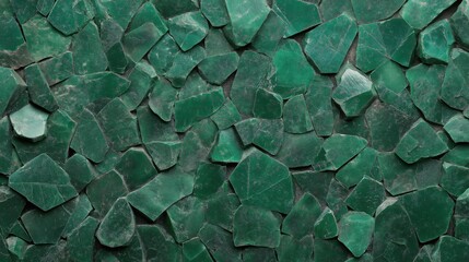 Emerald green crushed stone wall texture with rough irregular surfaces