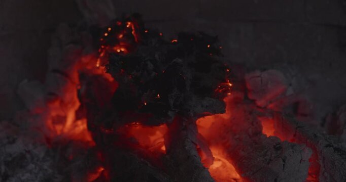 Burnt Paper Ash on Hot Coals in Fire