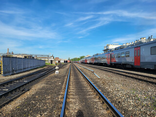 Fototapeta premium Rybinsk, Russia, 06 22 2024 Railway station, there are wagons and rails extending into the distance.