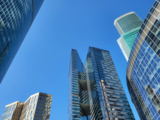 Obraz premium Moscow, Russia 09 10 2024 The Federation skyscrapers in the business district of Moscow City rise against the background of the blue sky. Modern architecture, background.