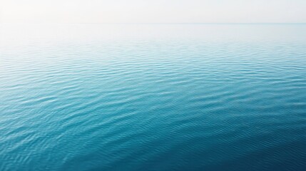 Obraz premium Calm waves lapping on serene ocean surface coastal area nature photography tranquil environment aerial view