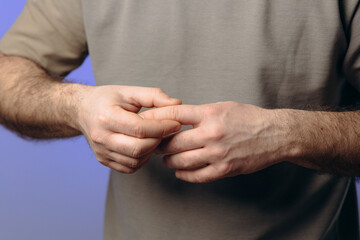 man suffers from chronic arthritis. pain in the joints of the fingers. inflammation of the joints,...