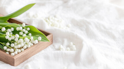 Spring harmony with lily of the valley on soft white fabric