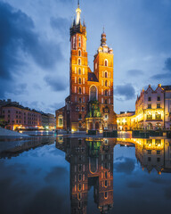 Cracow, Poland - St. Mary's Basilica on the Cracow Main Square at dusk. Beautiful Krakow old town, famous tourist attraction and travel destination	
