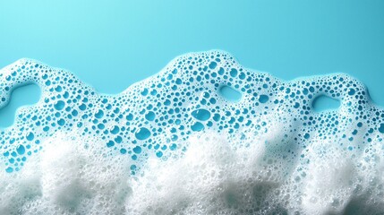 Frothy soap suds on a light blue background