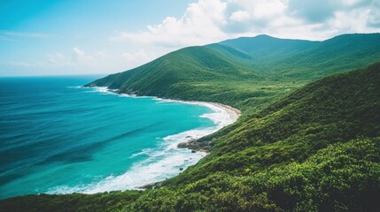 Serene Coastal Landscape: Lush Green Mountains Meeting Turquoise Ocean
