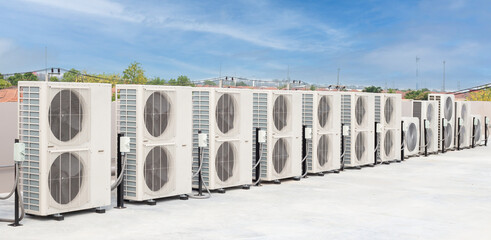 air conditioning and ventilation systems are installed on the roof of an industrial building.
