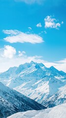 Obraz premium Majestic Snow-Capped Mountain Peaks Under Bright Blue Sky