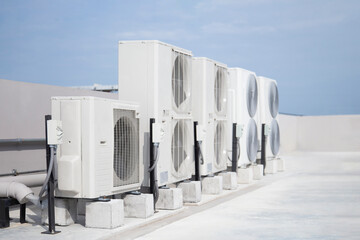 air conditioning and ventilation systems are installed on the roof of an industrial building.
