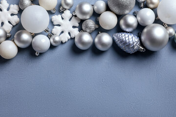 Christmas balls and decorative snowflakes on blue background