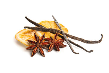 Anise stars with vanilla sticks and slices of dried orange on white background