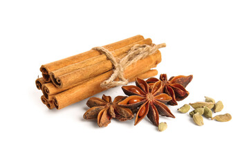 Anise stars with seeds and cinnamon on white background