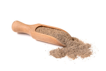 Wooden scoop with black pepper powder on white background