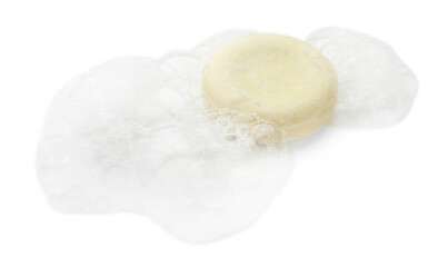 Round soap with foam on white background