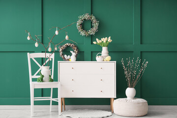 Interior of room with commode, chair and Easter wreaths