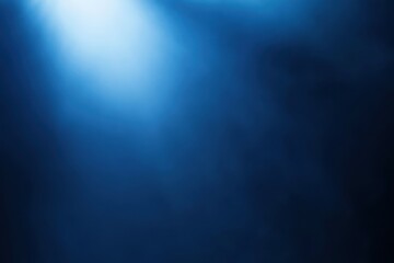 Midnight blue background with smooth texture and blurred white spotlight