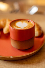 Steaming Elegance: Artisan Coffee Cup in a Modern Café 