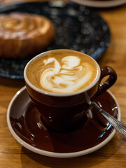 Steaming Elegance: Artisan Coffee Cup in a Modern Café 