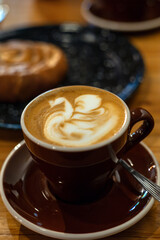 Steaming Elegance: Artisan Coffee Cup in a Modern Café 