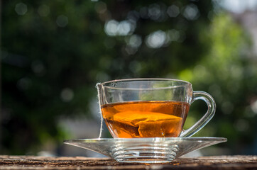 Cups of tea with bokeh on wooden table