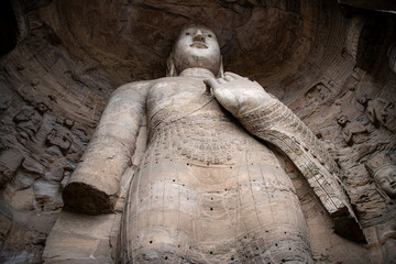 Yungang Grottoes. World cultural heritage. One of China's four most famous Buddhist Caves Art Treasure Houses, is located Datong, Shanxi Province. It is cave 20. Buddha is 13.7 metres high.