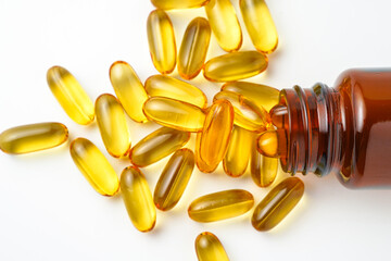 Vitamin capsules in a bottle, soft gels, Fish oil capsules, omega 3, omega 9, vitamin D, vitamin E