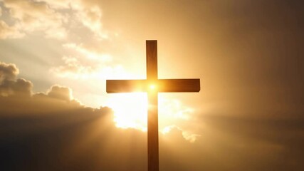 Christian cross silhouette with golden sunlight and dramatic clouds. Religious background for Easter, Christmas and Good Friday. Spiritual worship concept