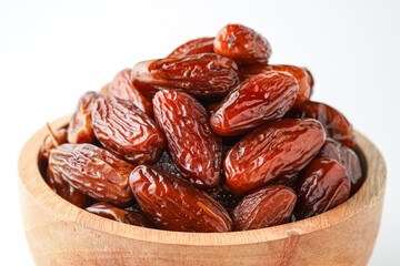 Dates fruit tunisia, Tunisian honey dates, in bowl isolated on white background