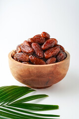 Dates fruit tunisia, Tunisian honey dates, in bowl isolated on white background