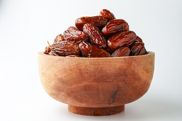 Dates fruit tunisia, Tunisian honey dates, in bowl isolated on white background