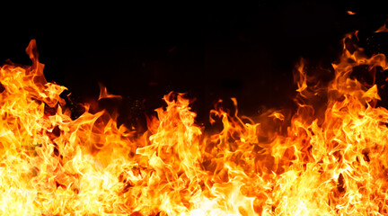 An intense image of red flames blazing against a black background.