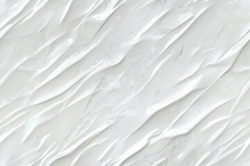 Obraz premium A close-up of crumpled white plastic or paper texture, showcasing smooth and shiny surfaces with subtle reflections and shadows.