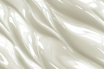 Fototapeta premium A smooth, glossy surface with flowing, wavy patterns in a light cream color. The texture reflects light, creating a sense of depth and movement.