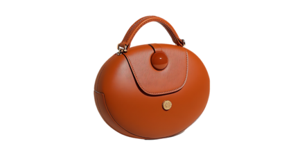 Round tan leather handbag, studio shot